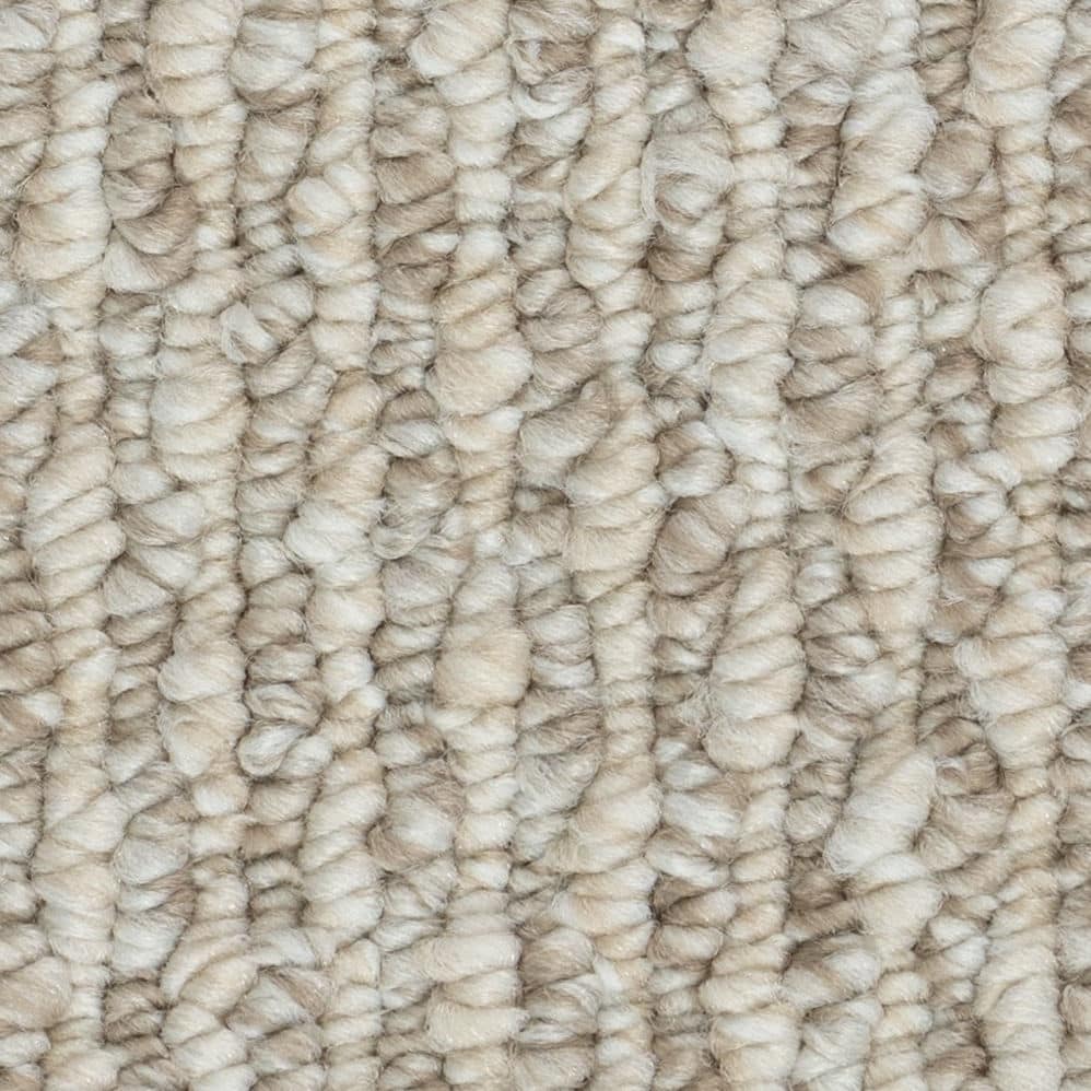 Close-up of beige looped carpet texture