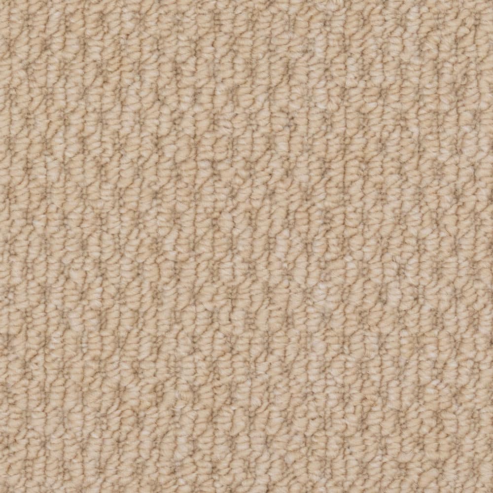 Close-up of beige textured carpet surface