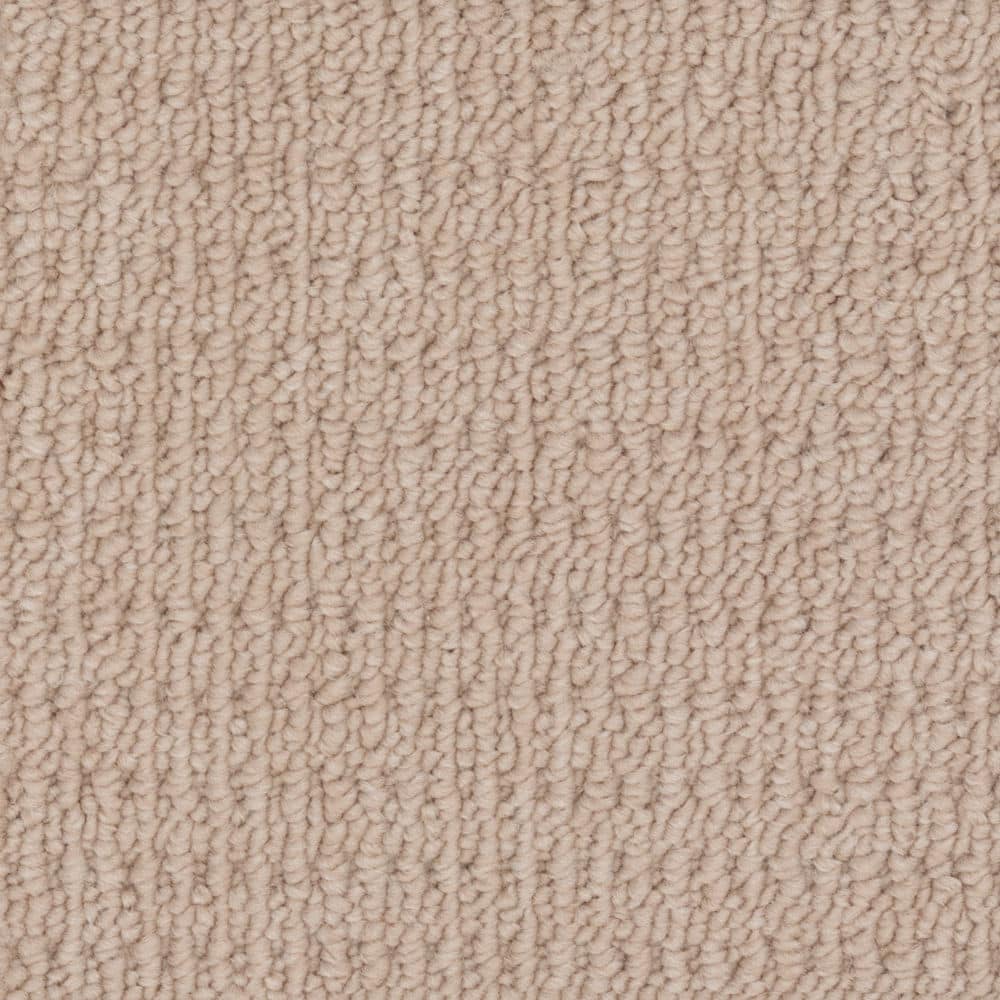 Close-up of beige textured carpet surface