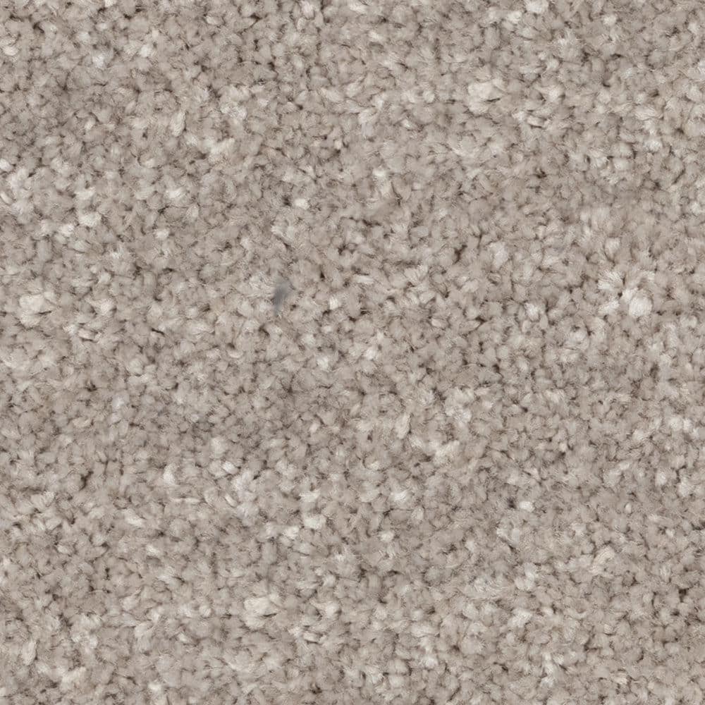 Close-up of beige textured carpet fibers