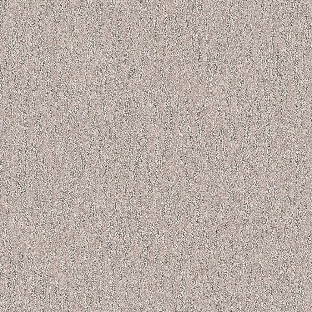 Close-up of beige textured carpet surface