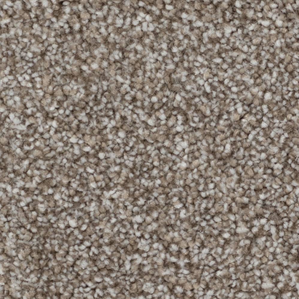 Close-up of beige textured carpet fibers