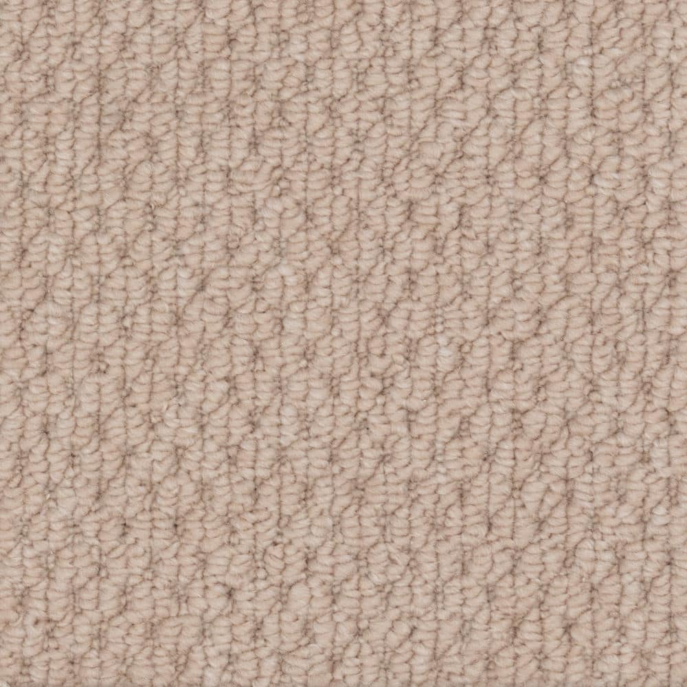 Close-up of beige textured carpet surface
