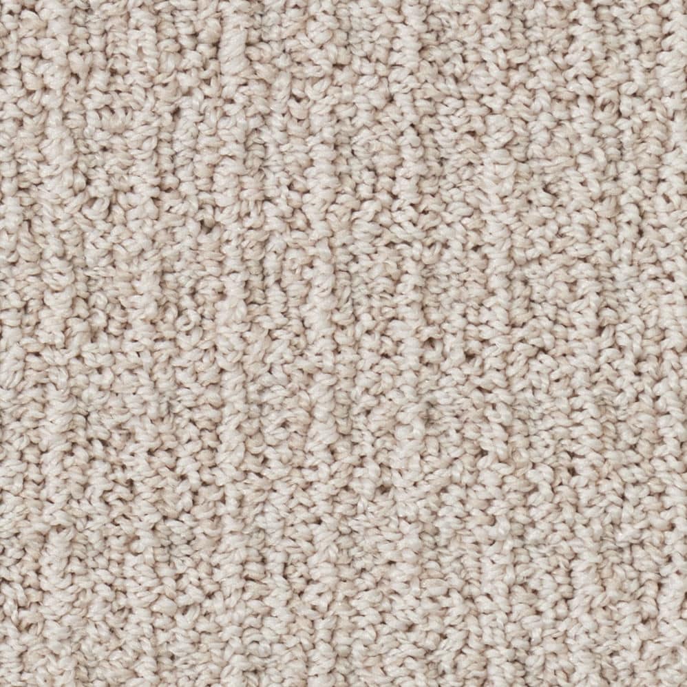 Close-up of beige textured carpet fibers