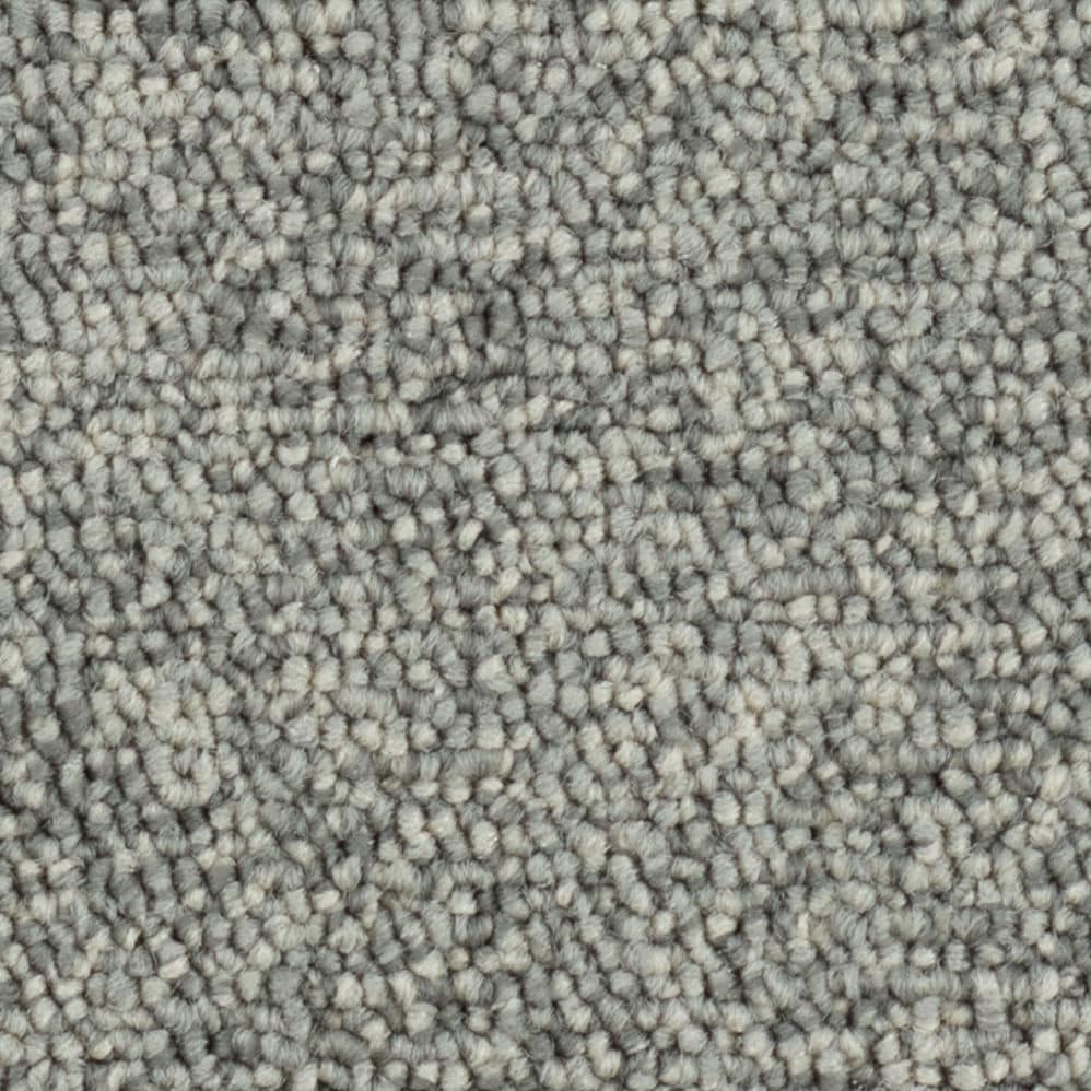 Close-up of gray textured carpet fibers