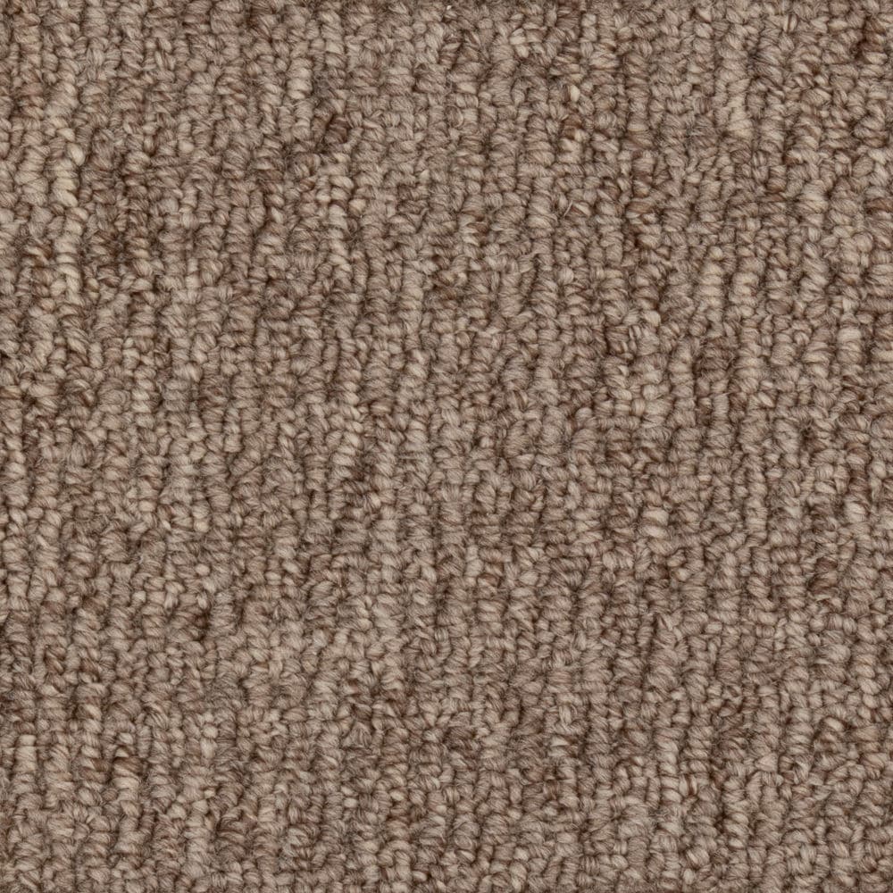 Close-up of brown textured carpet fibers
