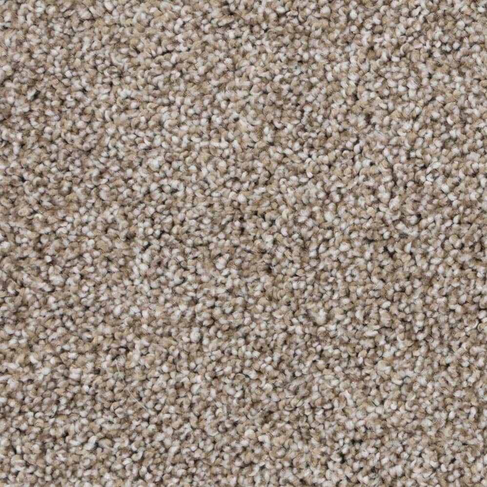 Close-up of beige textured carpet fibers