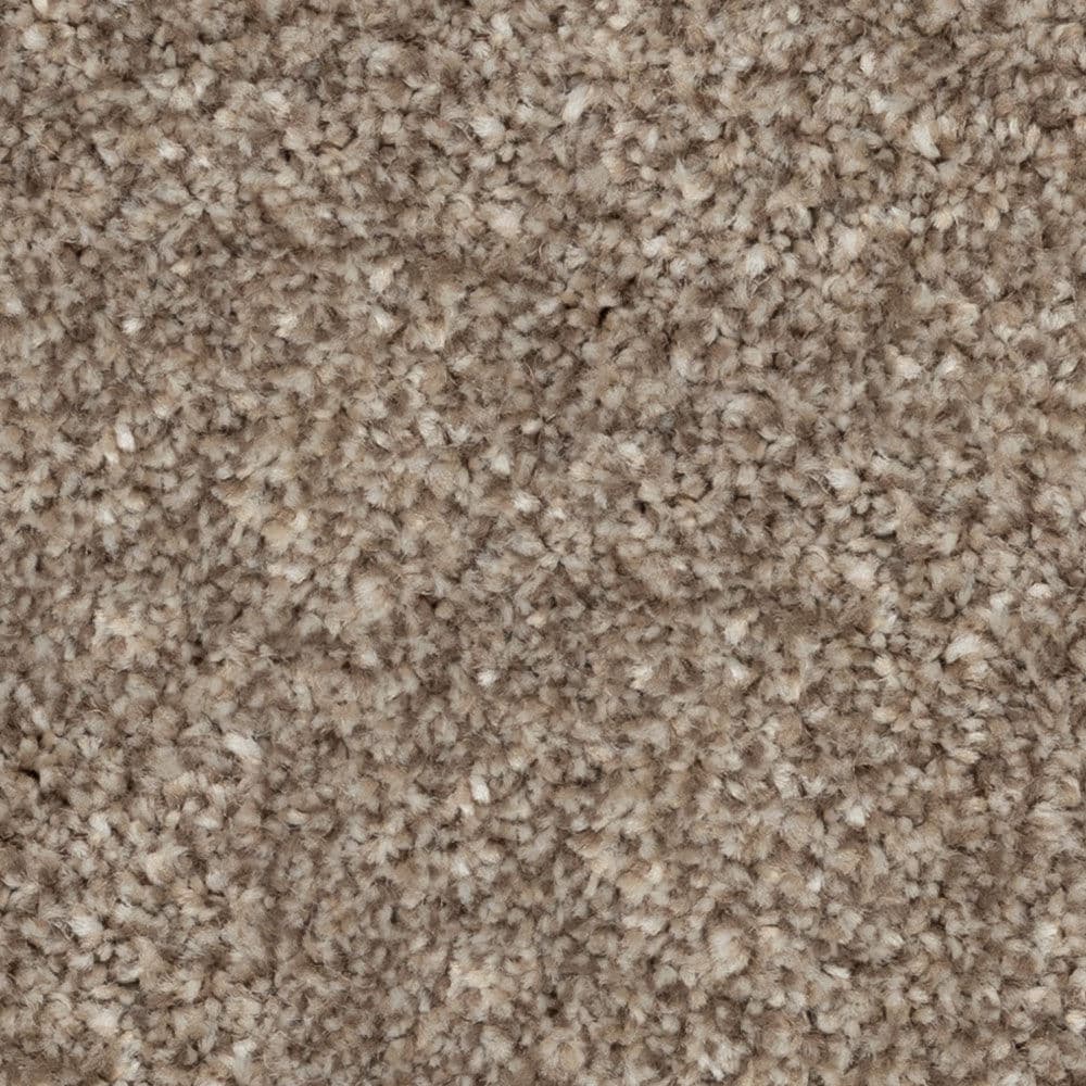 Close-up of beige textured carpet fibers