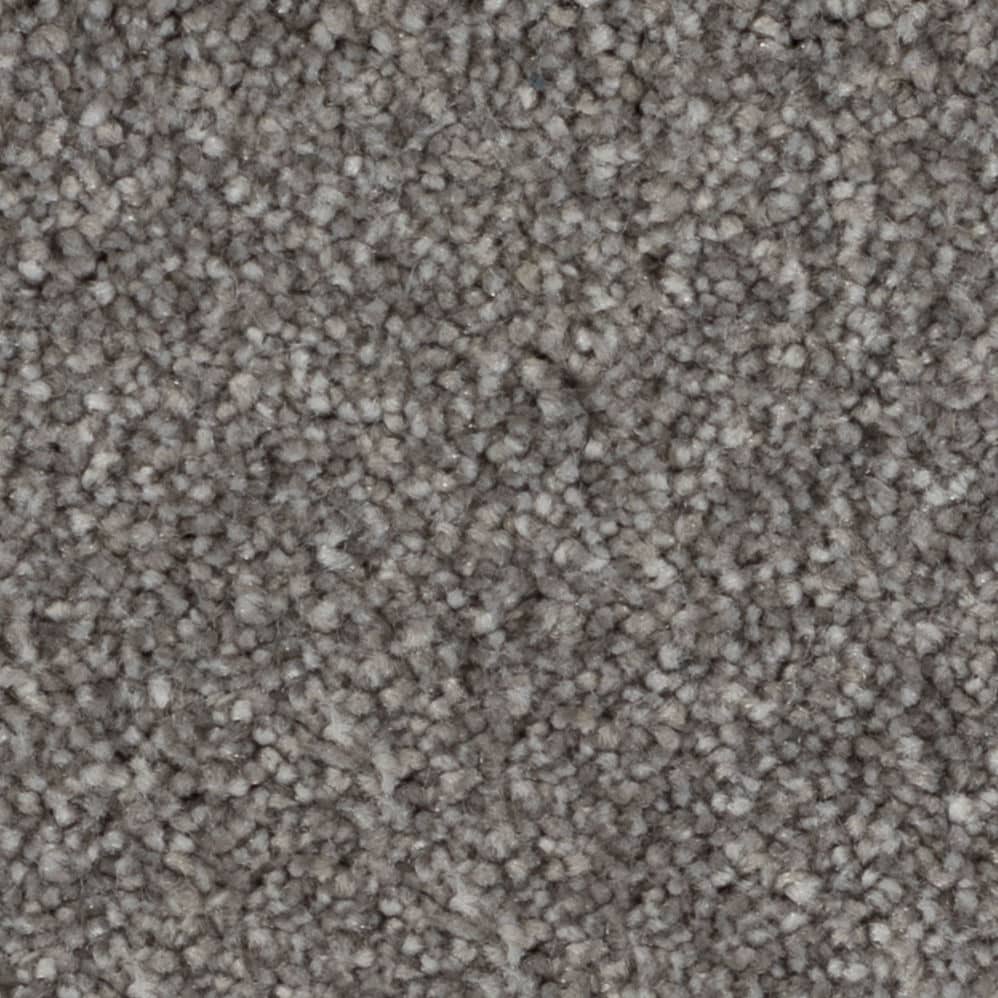 Close-up of gray textured carpet fibers