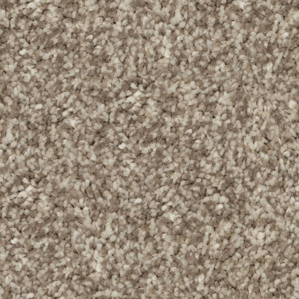 Close-up of beige textured carpet fibers