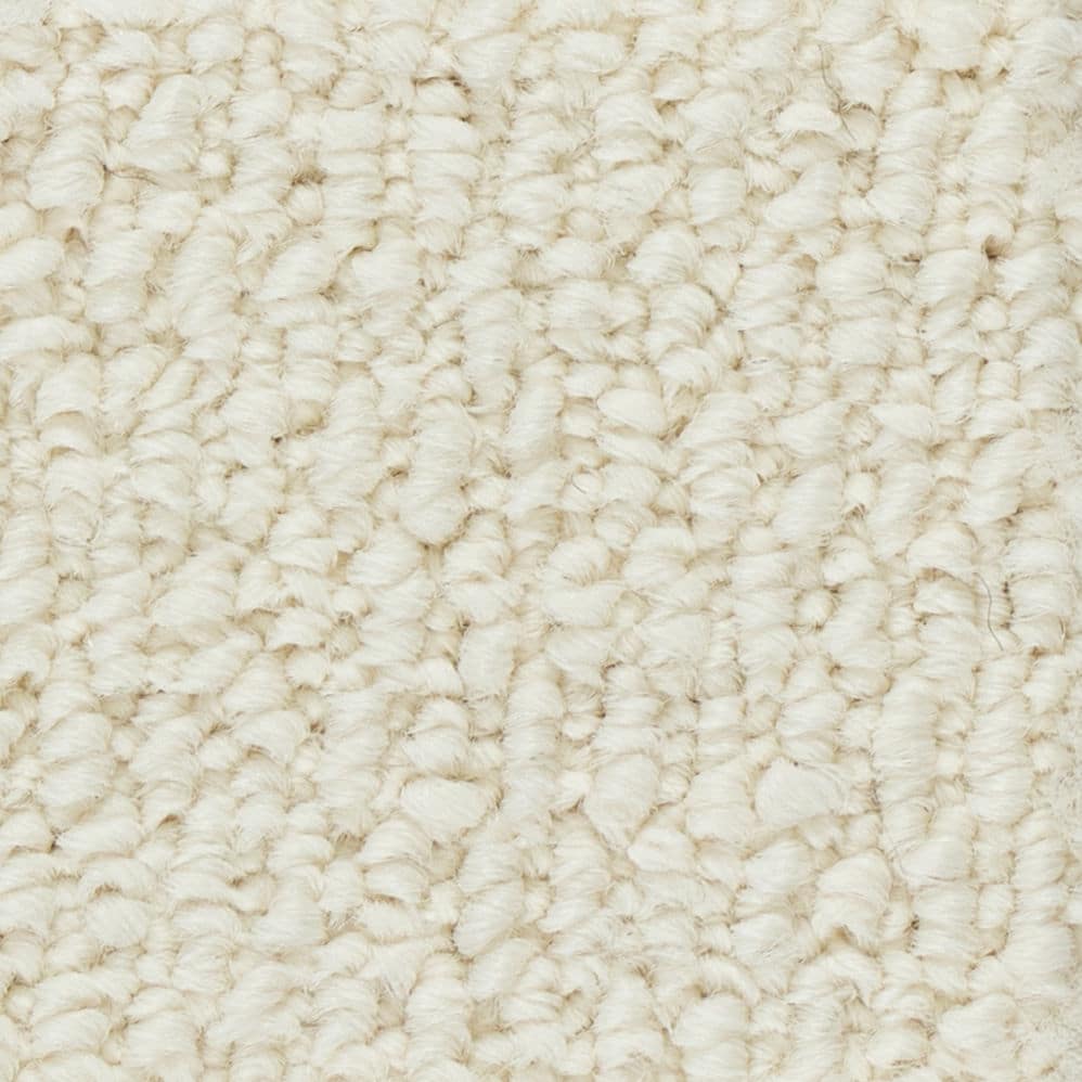 Close-up of beige textured carpet fibers