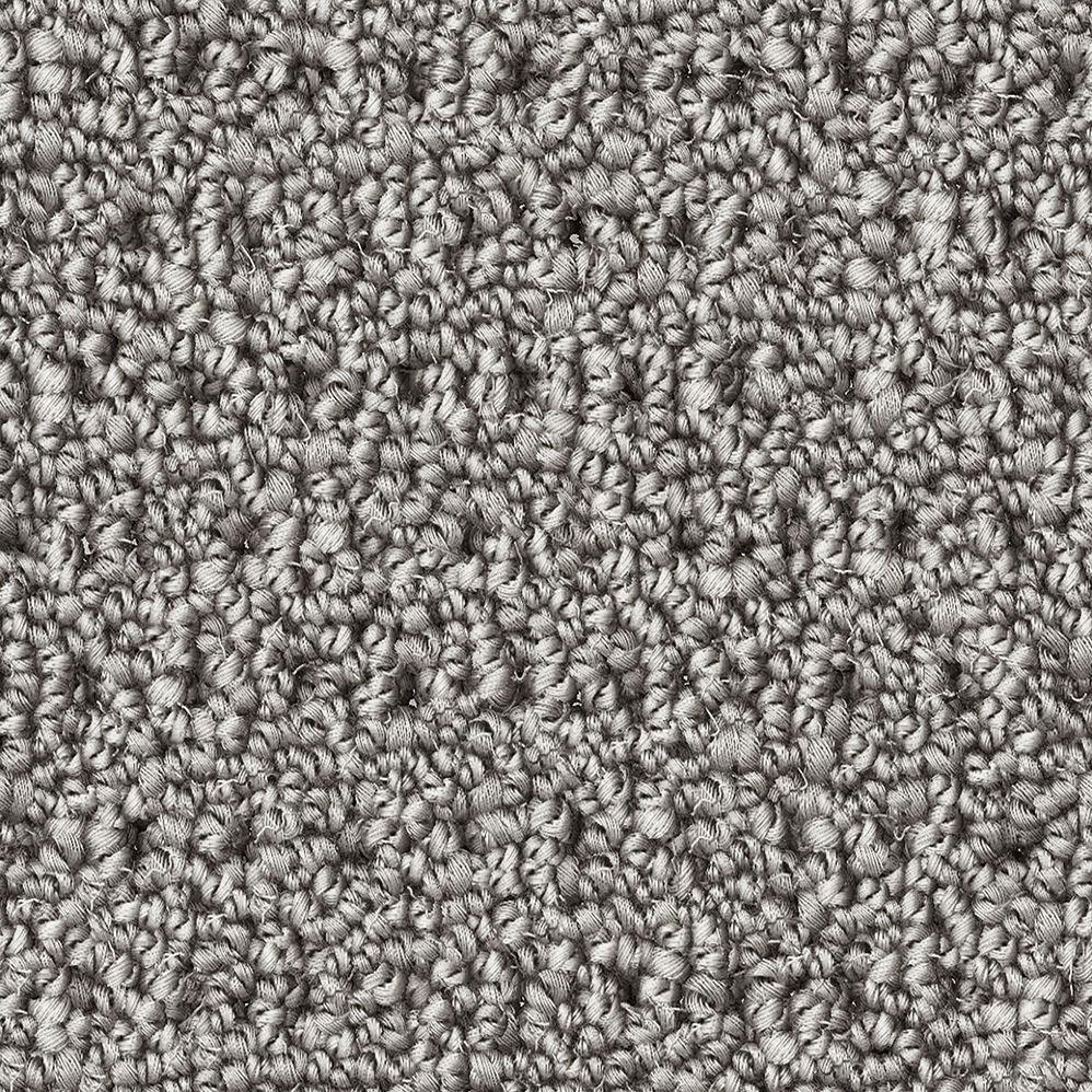 Close-up of gray textured carpet fibers