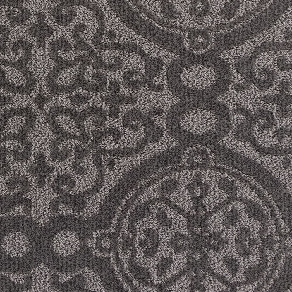 Gray patterned carpet with ornate medallion design