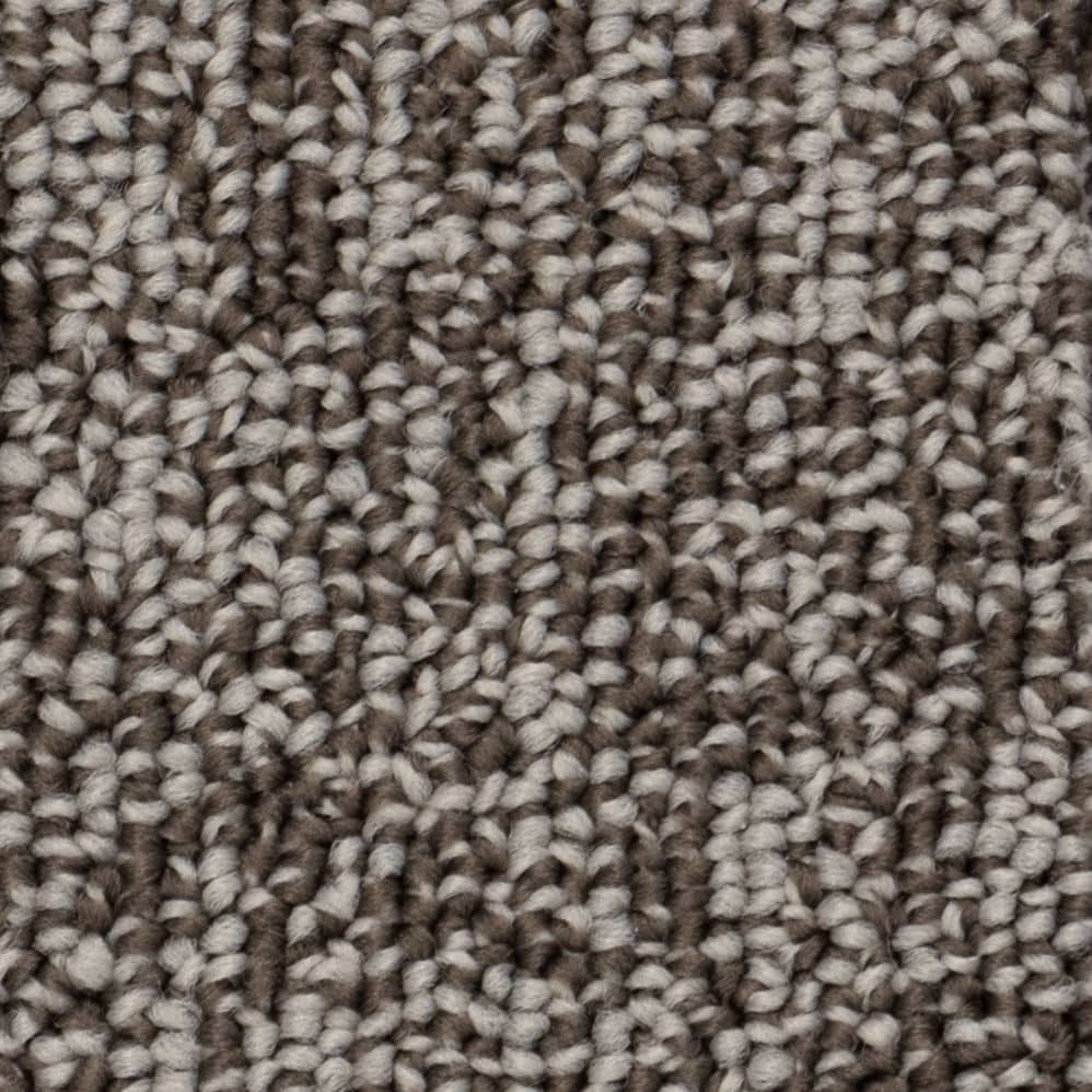 Close-up of gray and brown carpet fibers