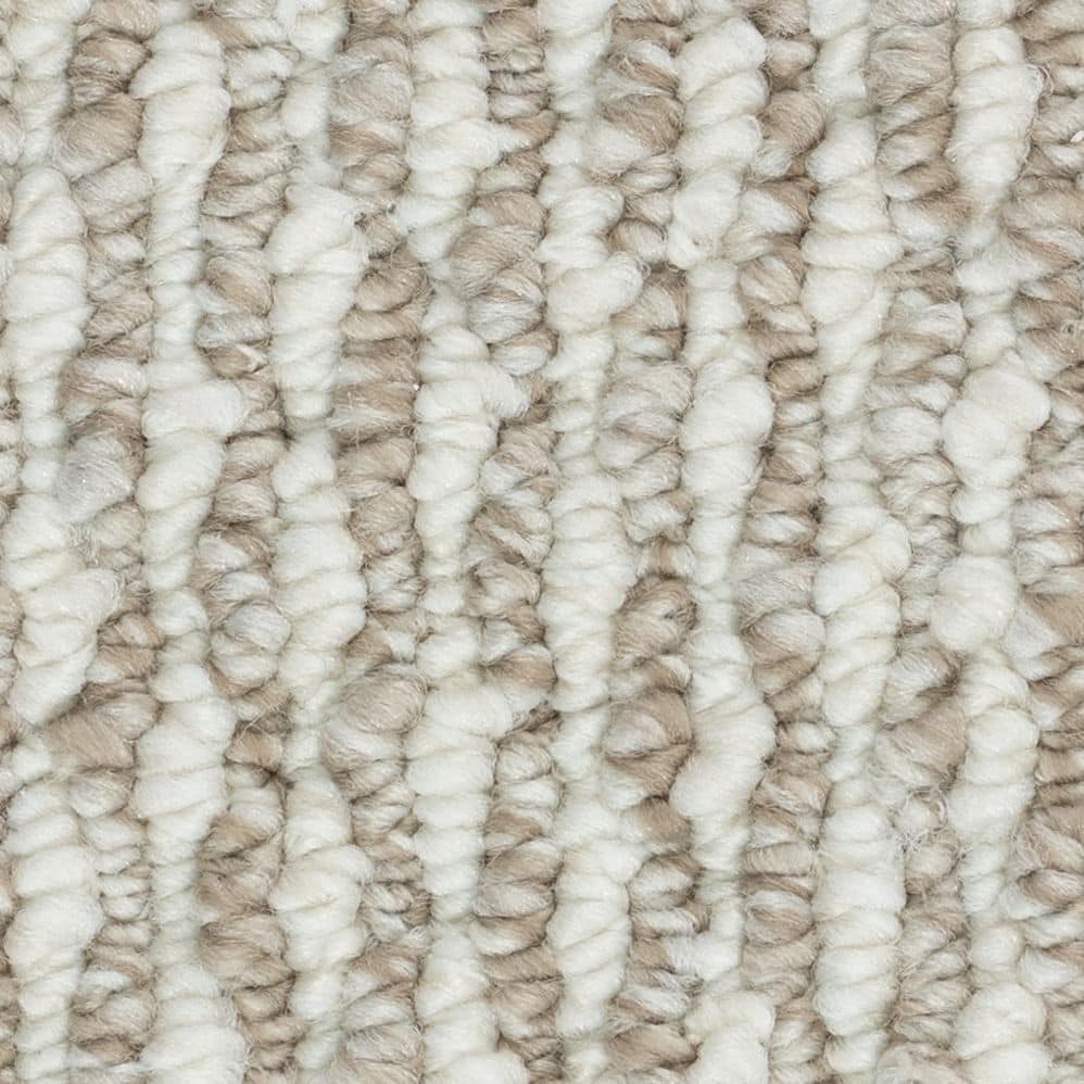 Close-up of beige textured carpet fibers