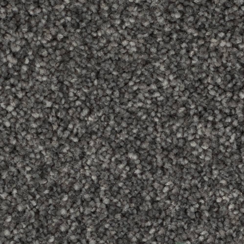 Close-up of dark gray textured carpet fibers