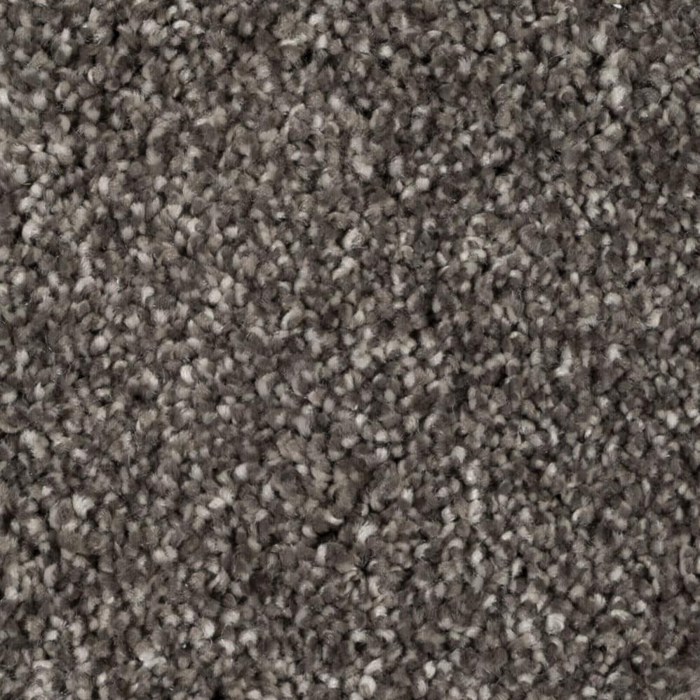 Close-up of gray textured carpet fibers