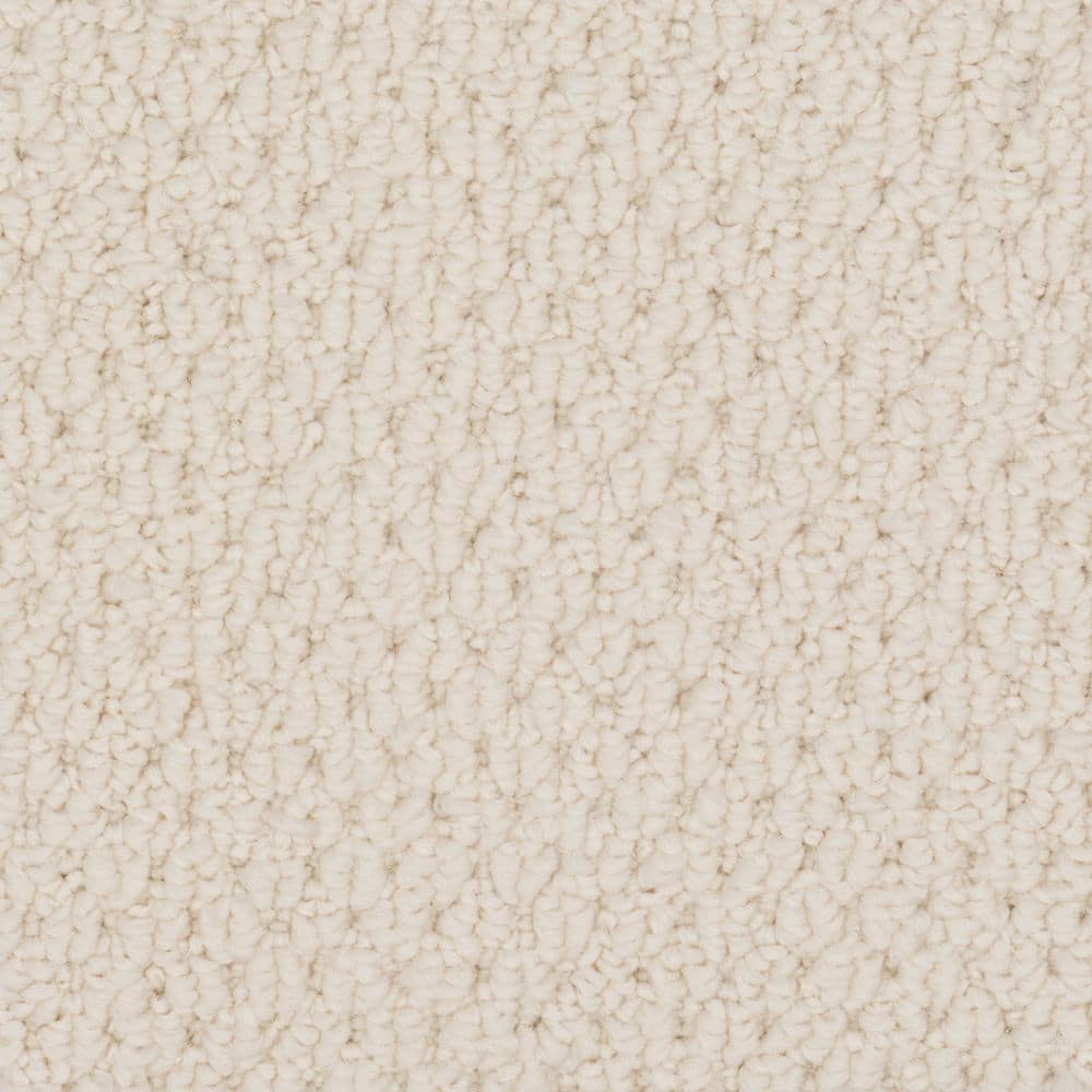 Close-up of cream textured carpet surface