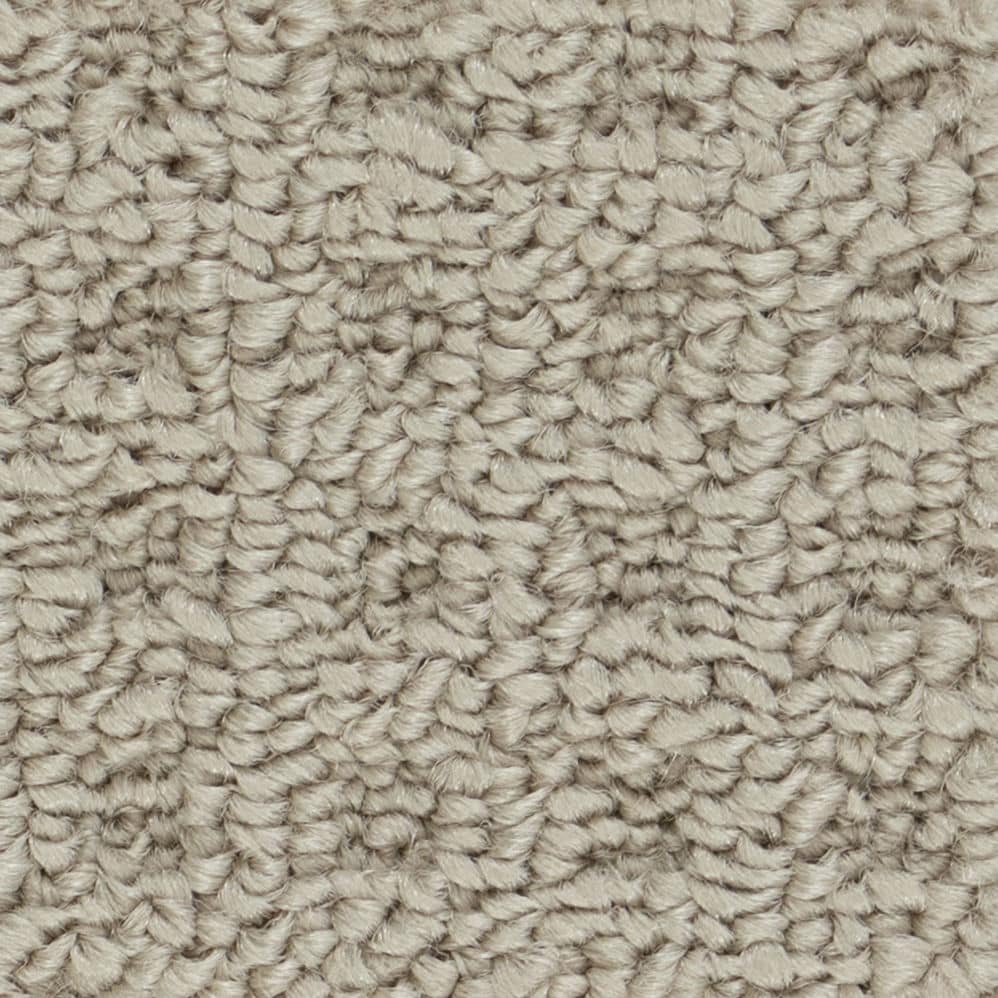 Close-up of beige textured carpet fibers