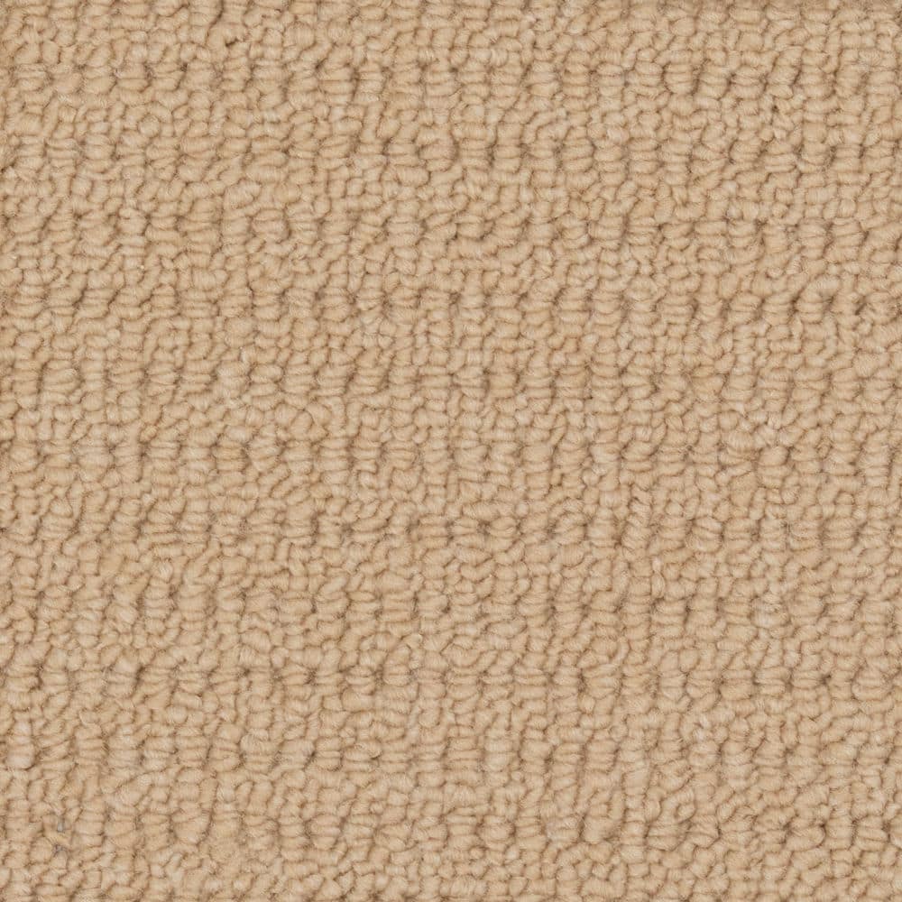 Close-up of beige textured carpet surface