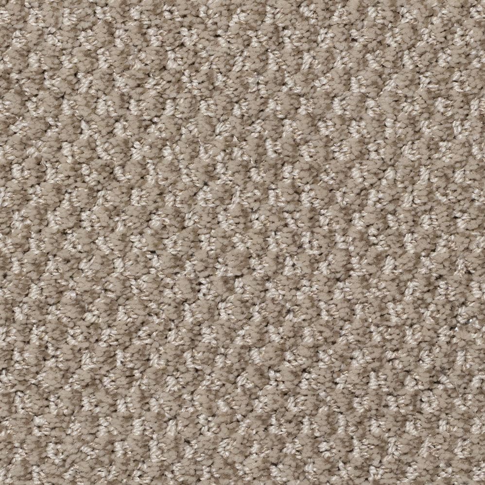 Close-up of beige textured carpet fibers
