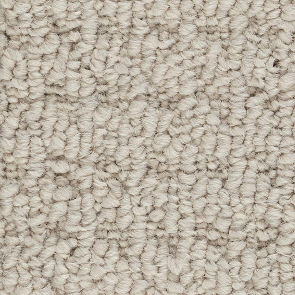 Close-up of beige loop pile carpet texture