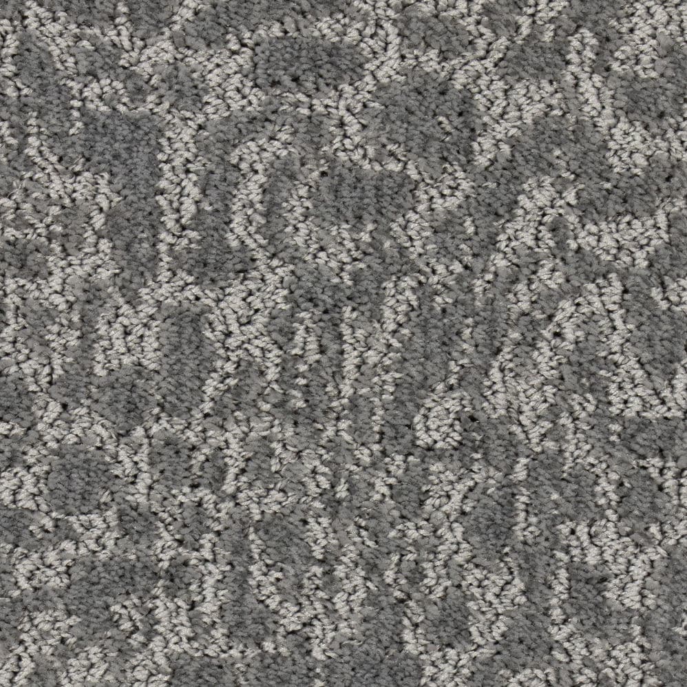 Gray textured carpet with subtle circular pattern