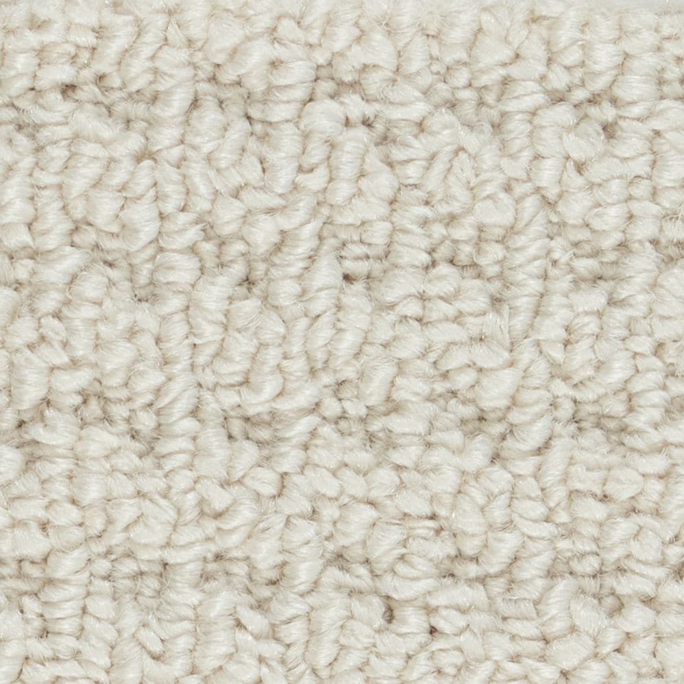 Close-up of beige textured carpet fibers