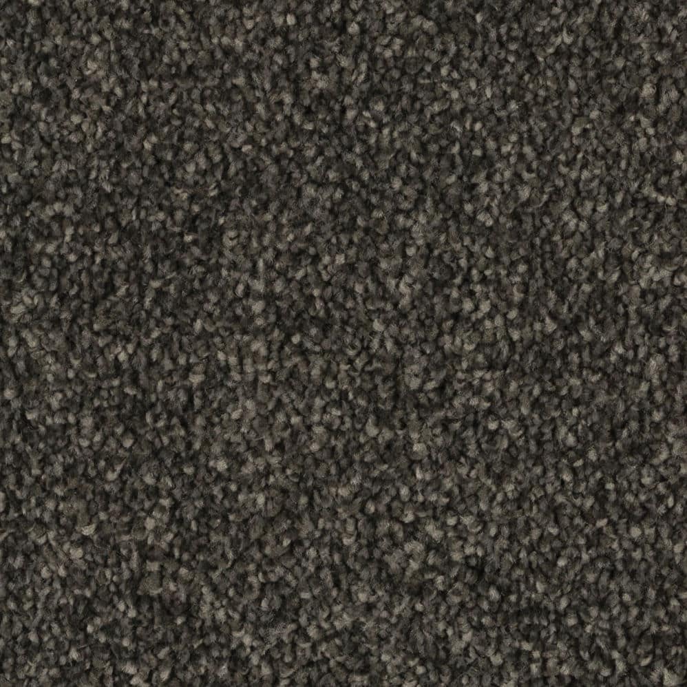 Close-up of dark gray textured carpet fibers