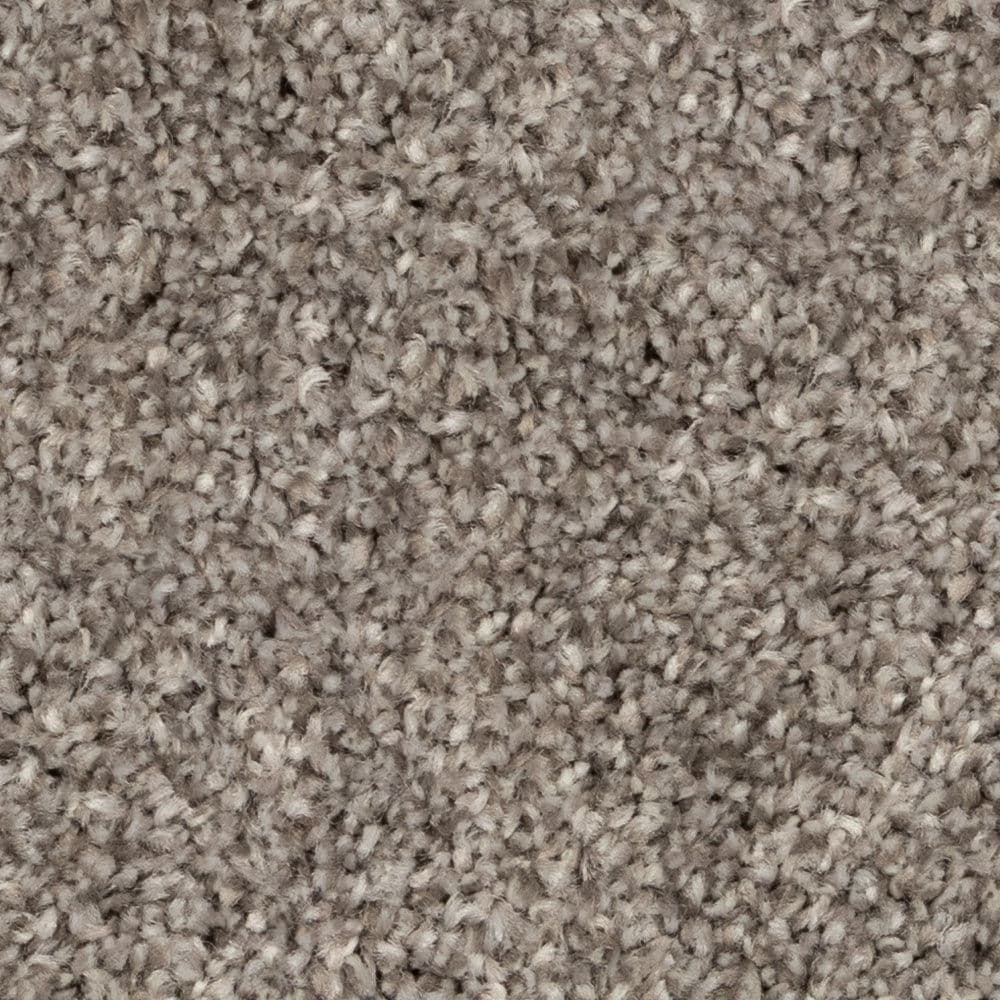 Close-up of beige textured carpet fibers
