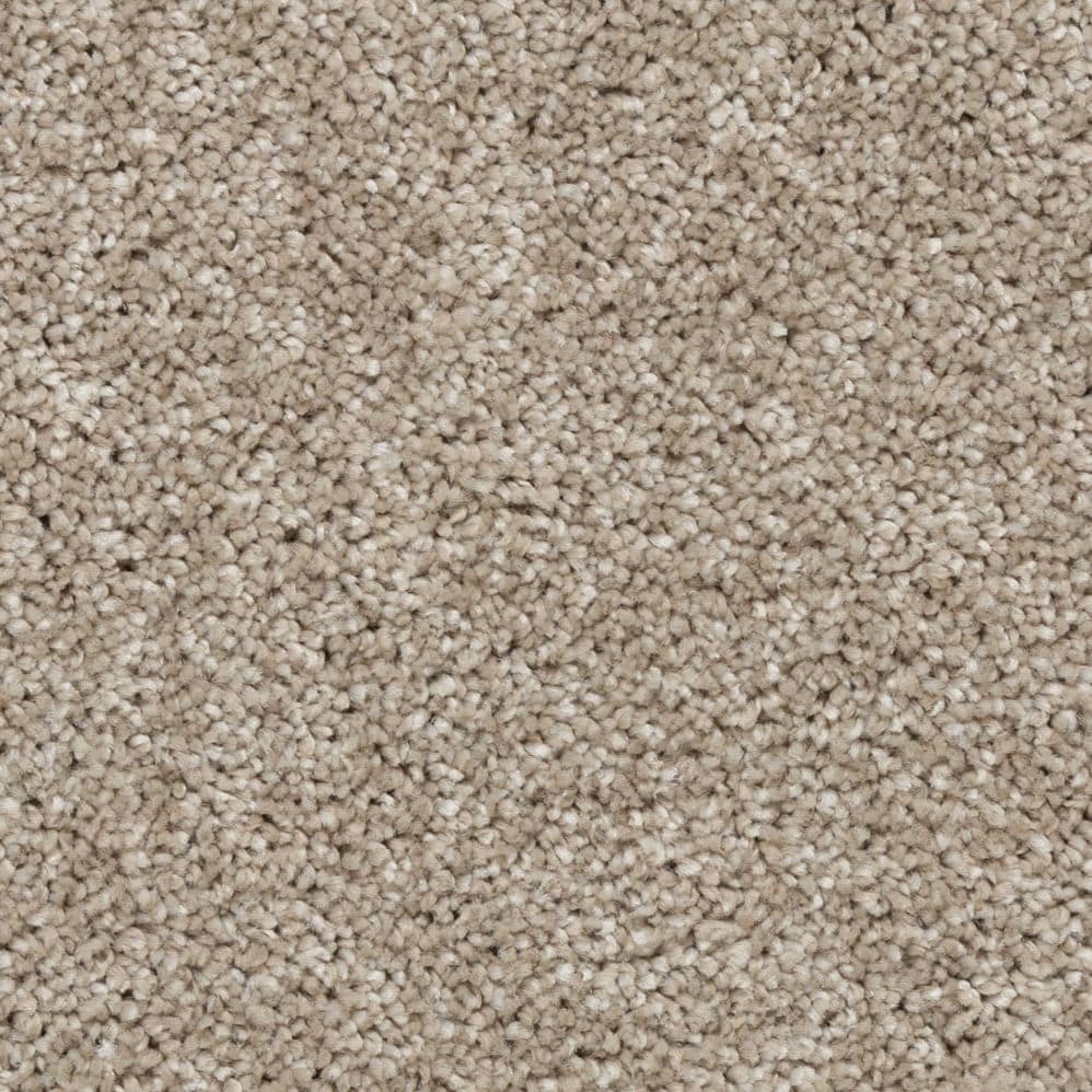 Close-up of beige textured carpet fibers