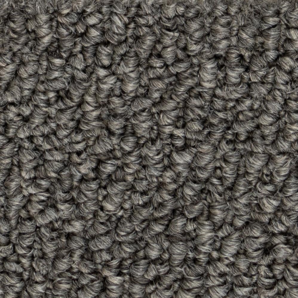Close-up of gray textured carpet fibers