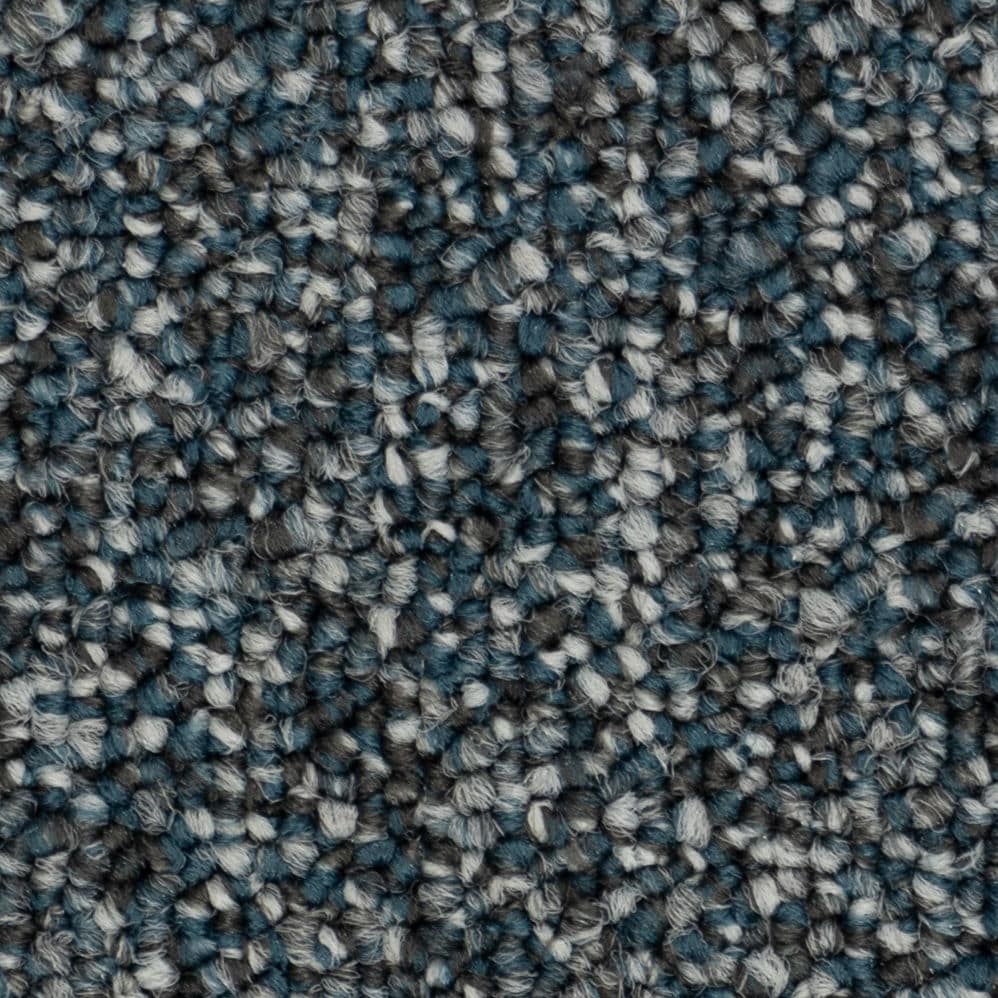 Close-up of blue and gray textured carpet fibers