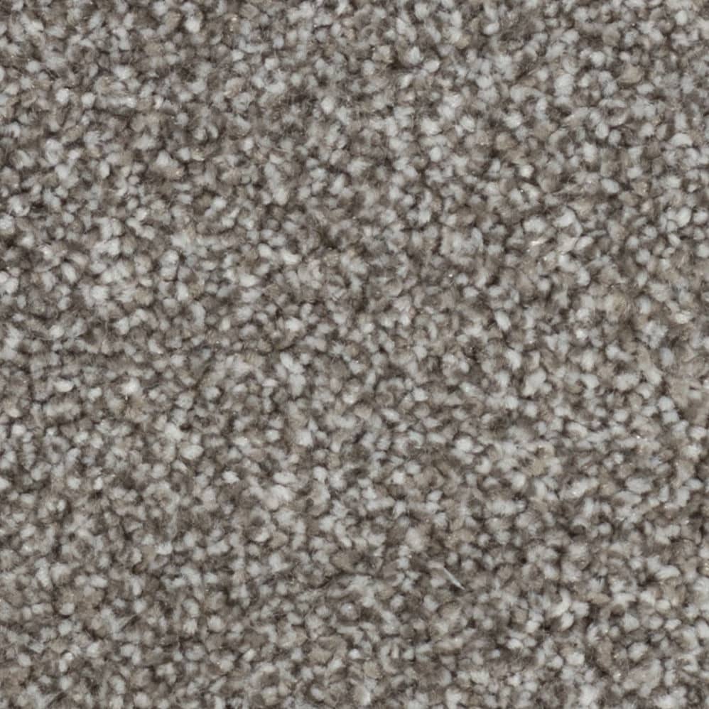 Close-up of beige textured carpet fibers