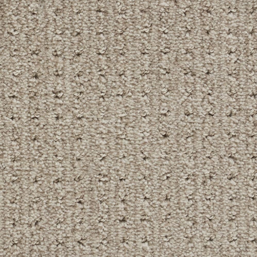 Close-up of beige textured carpet surface