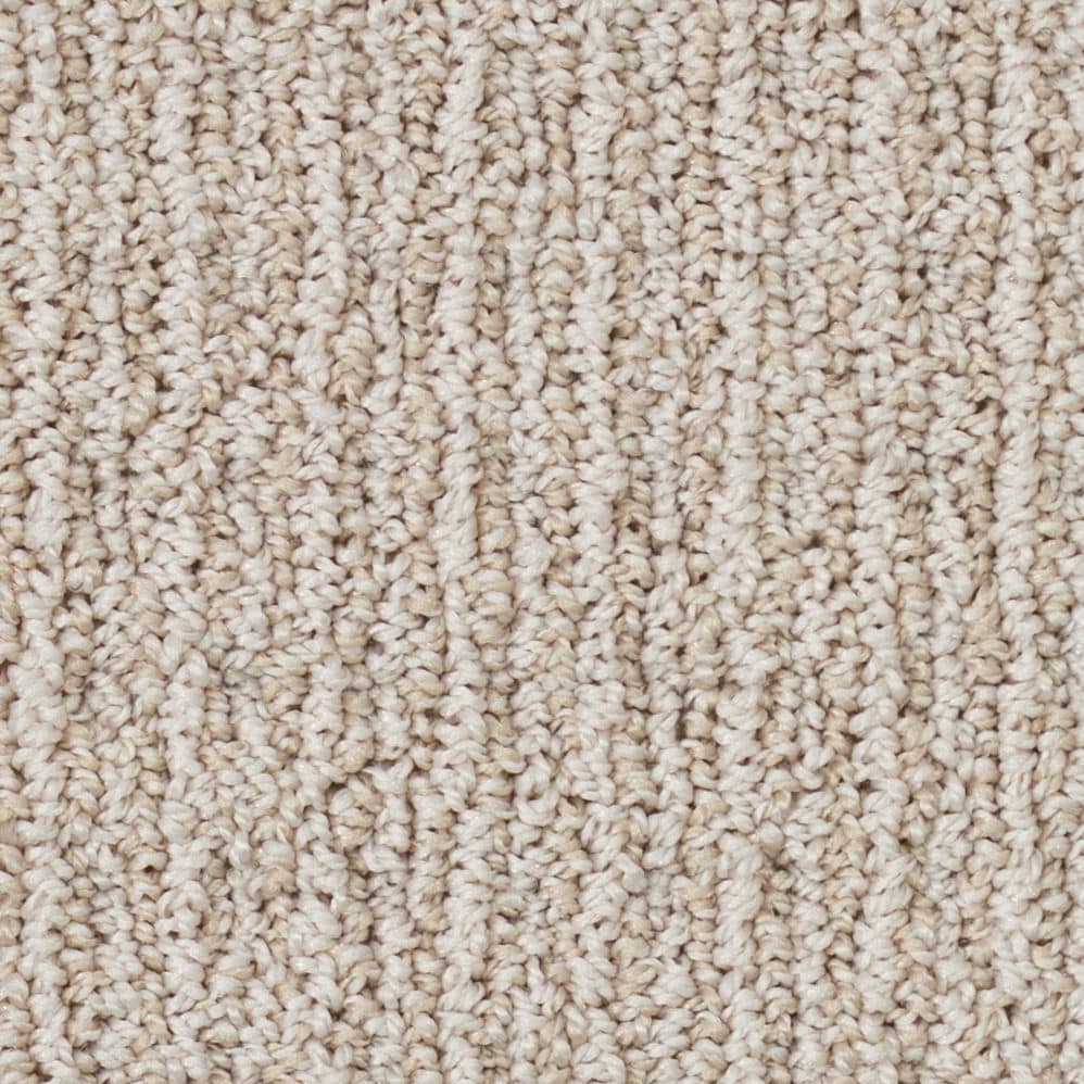Close-up of beige textured carpet fibers