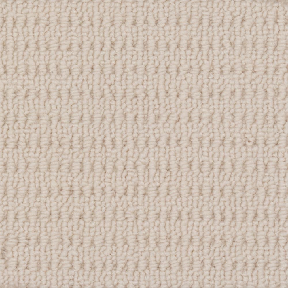 Close-up of beige textured carpet surface