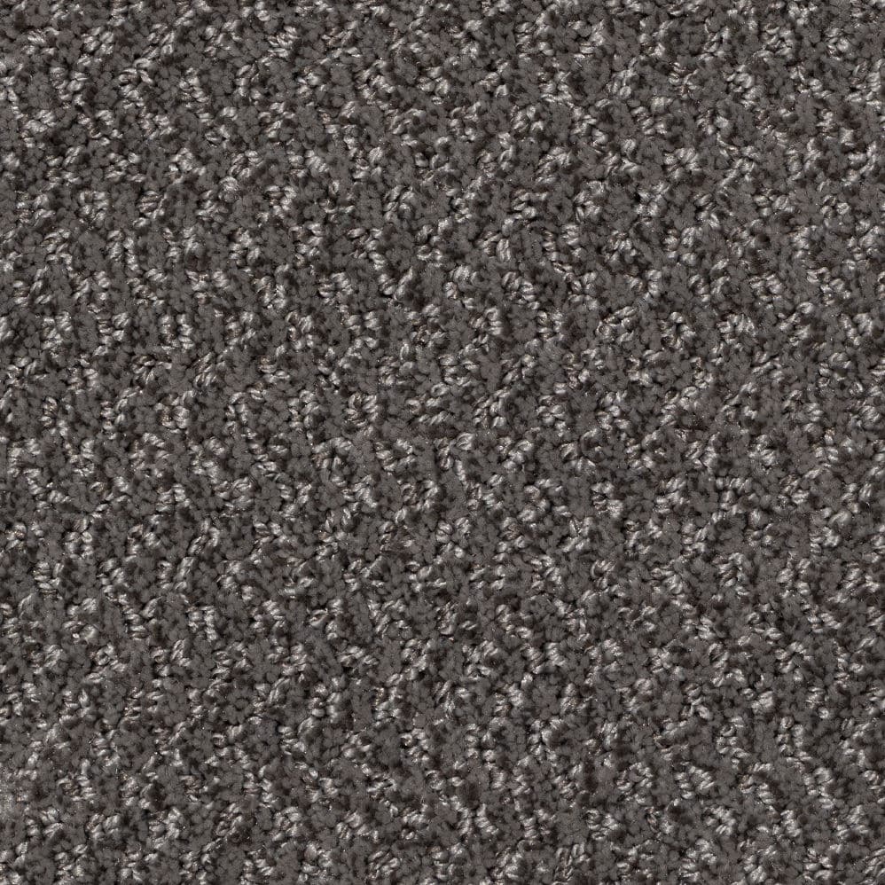Close-up of gray textured carpet fibers