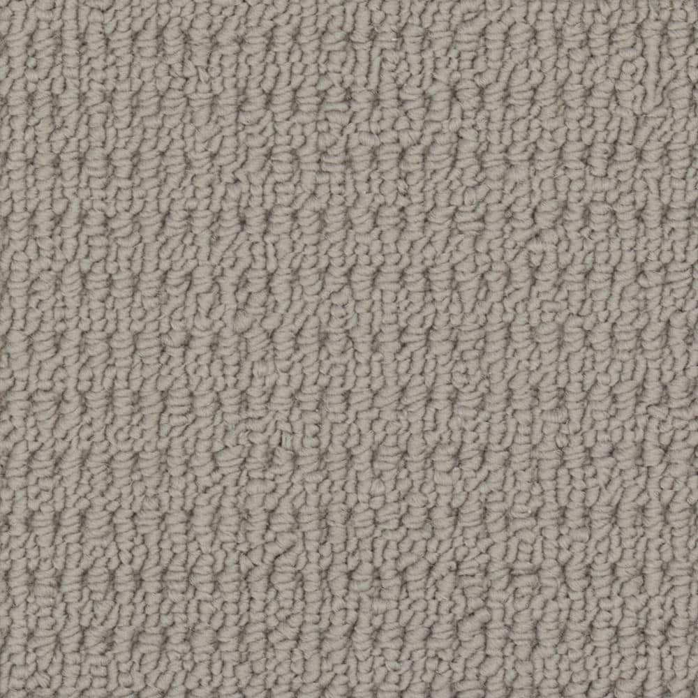 Close-up of beige looped carpet texture