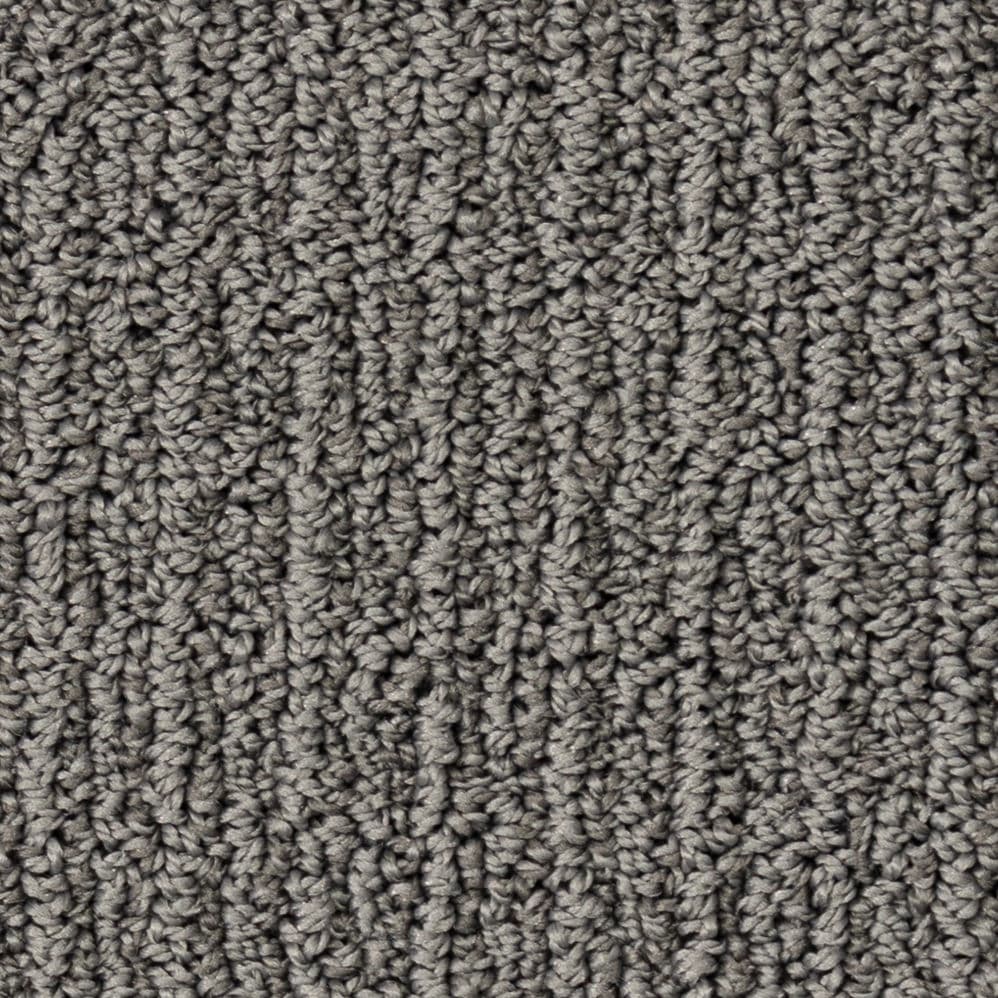 Close-up of gray textured carpet fibers