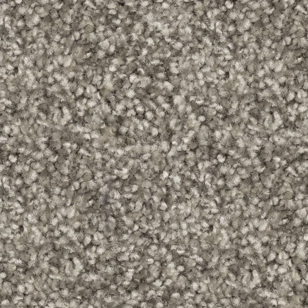 Close-up of beige textured carpet fibers