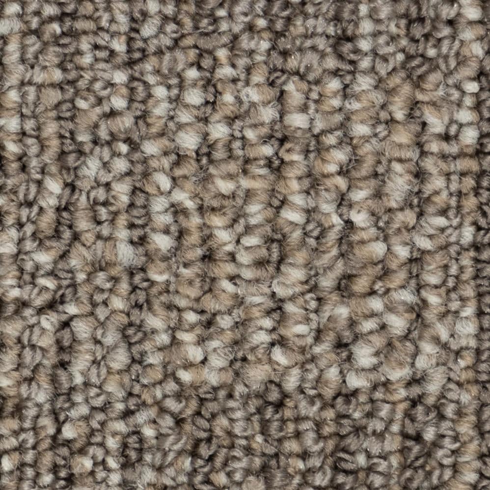 Close-up of beige textured carpet fibers