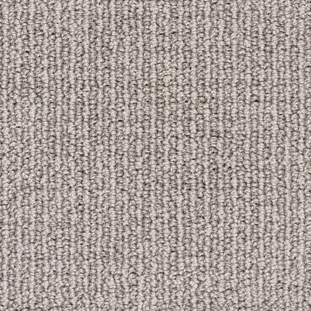 Close-up of light gray textured carpet fibers