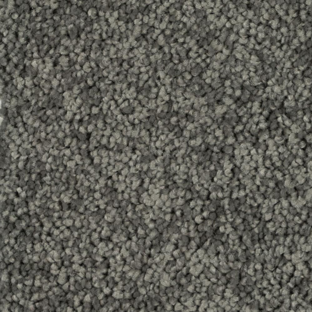 Close-up of gray textured carpet fibers