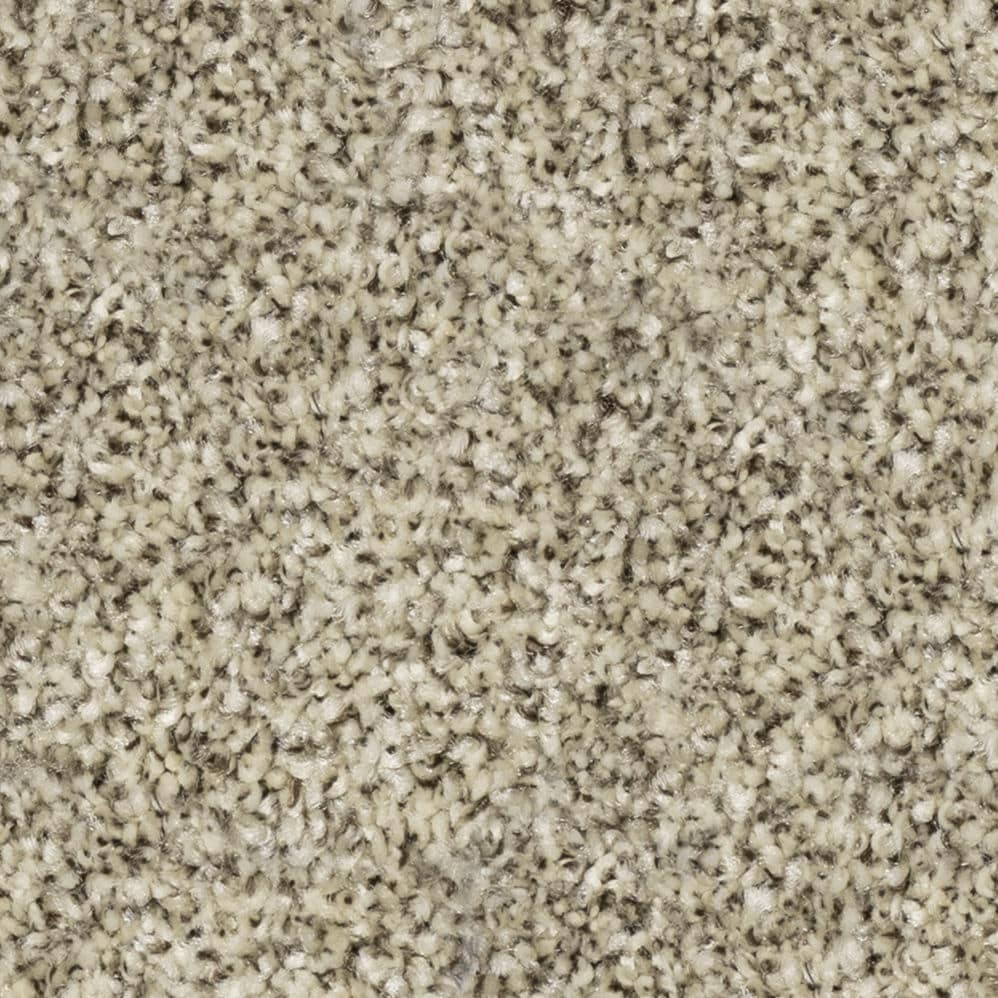 Close-up of beige textured carpet fibers