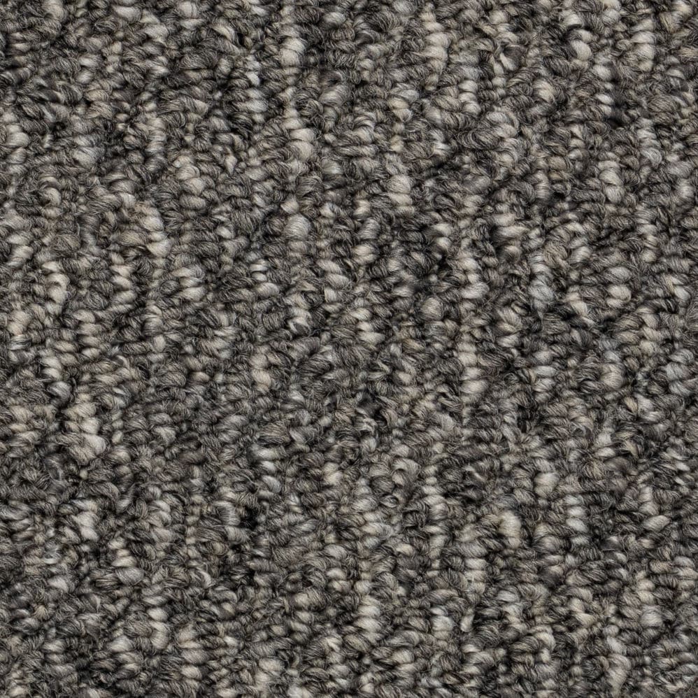 Close-up of gray textured carpet fibers