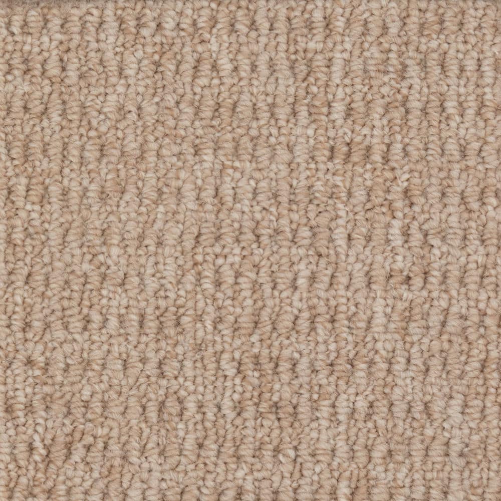Close-up of beige textured carpet surface