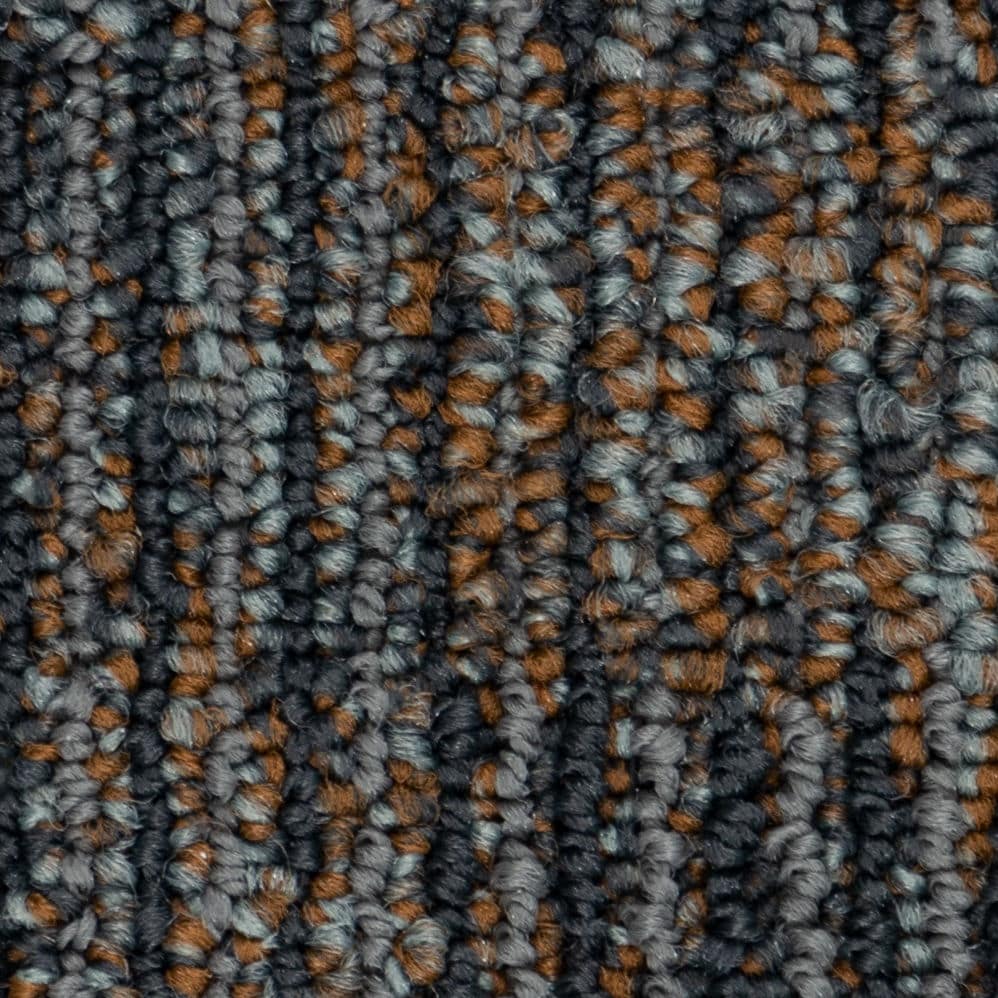 Close-up of gray and brown textured carpet fibers