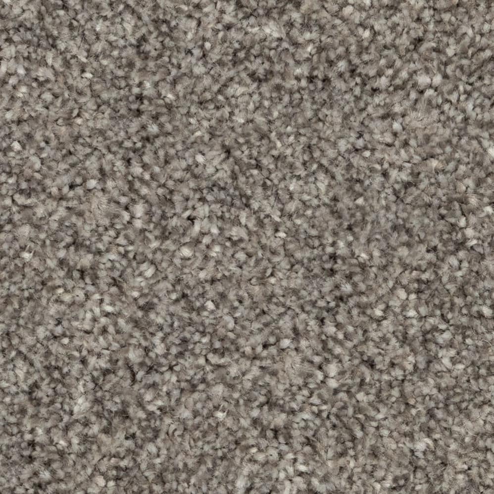 Close-up of beige textured carpet fibers