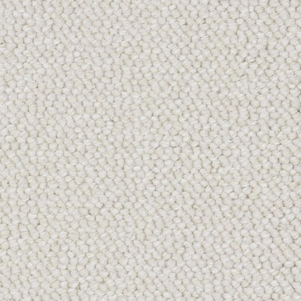 Close-up of light cream textured carpet surface